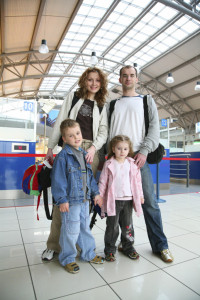 standing traveling family of four